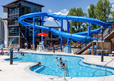 A view of the hot pool and water slides in during a summer day at the hot springs.